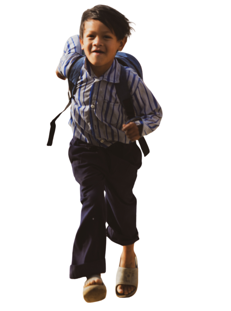 Boy supported by Karuna's community projects in South Asia running outdoors